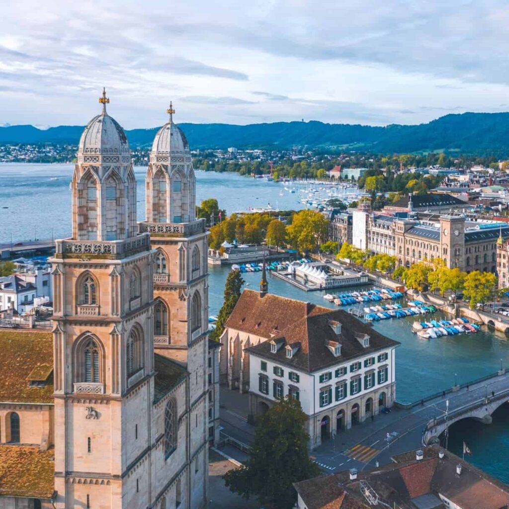 Historic church towers overlooking Lake Zurich in Switzerland.